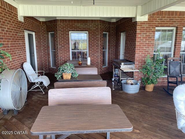3643 Mt Carmel Road Decaturville, TN 38329 - Photo 44 of 71 a view of a patio with couches table and chairs and potted plants