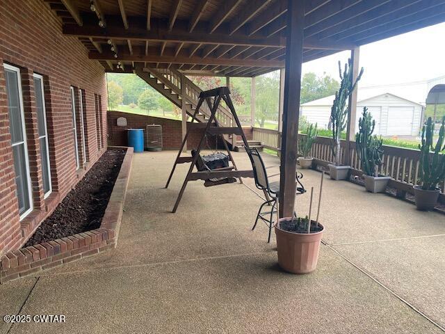 3643 Mt Carmel Road Decaturville, TN 38329 - Photo 47 of 71 a view of a patio with a table chairs and a potted plant