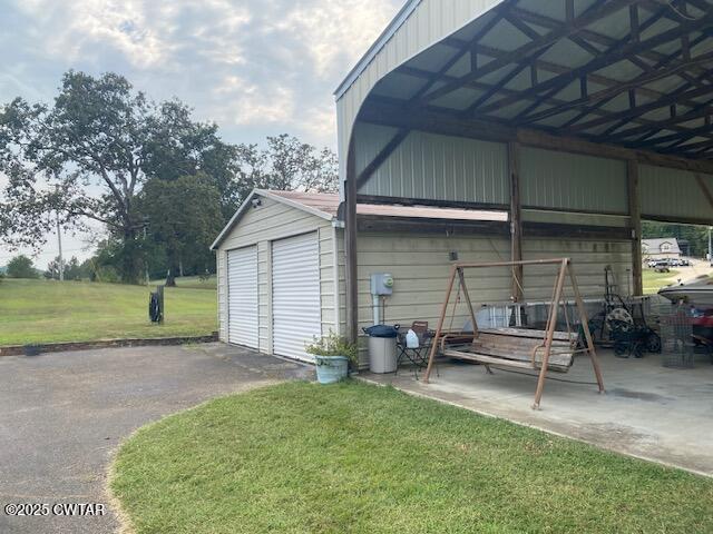 3643 Mt Carmel Road Decaturville, TN 38329 - Photo 56 of 71 a view of a chair and table in backyard of the house