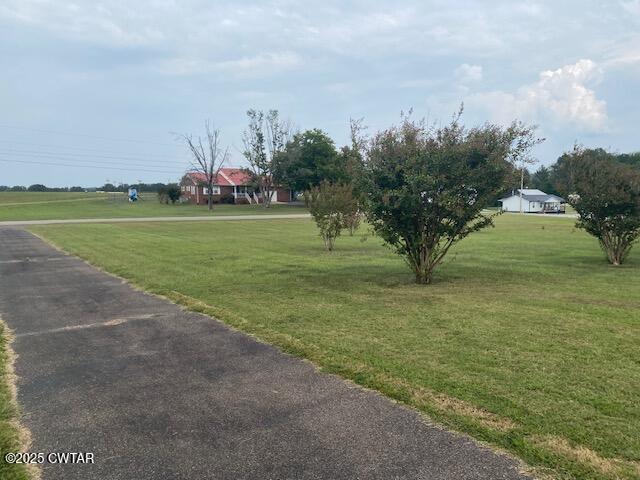 3643 Mt Carmel Road Decaturville, TN 38329 - Photo 57 of 71 a view of a golf course with a lake