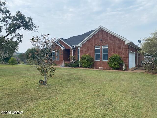 3643 Mt Carmel Road Decaturville, TN 38329 - Photo 66 of 71 a front view of a house with garden