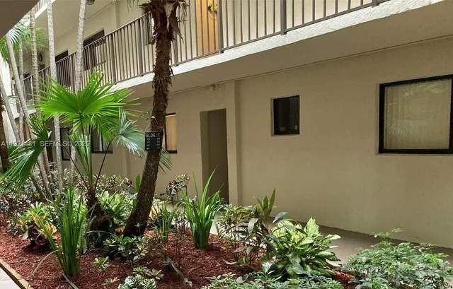 a plant that is in front of a door