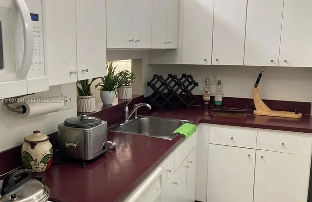 a kitchen with a stove and a sink
