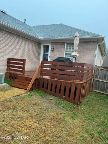 a front view of house with a garden