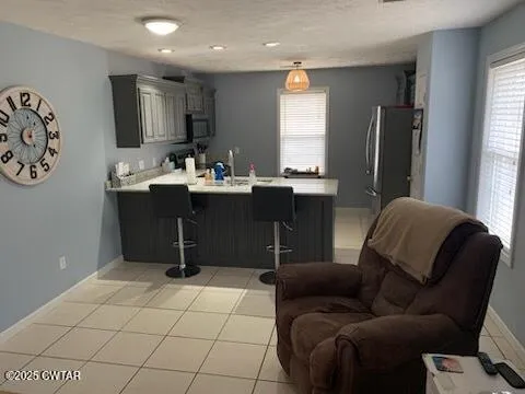 a living room with furniture window and a flat screen tv