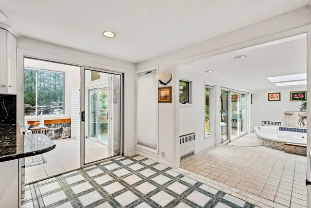 a spacious bedroom with a large bed and a window