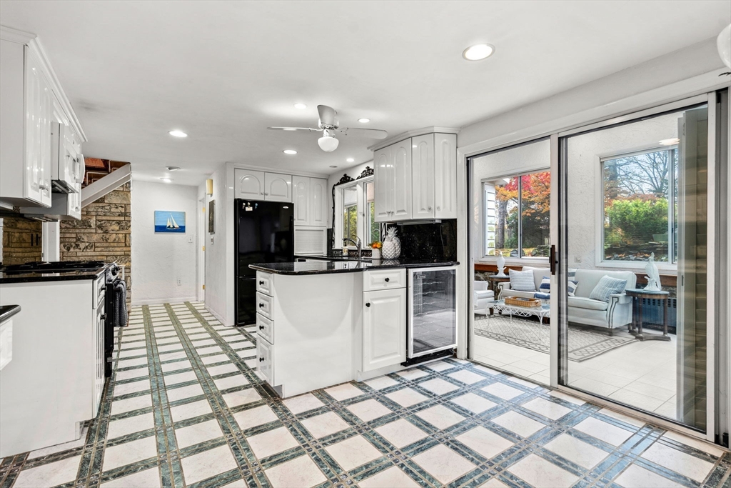 10 Quadrant Road Salem, MA 01970 - Photo 14 of 42 a kitchen with stainless steel appliances kitchen island granite countertop a refrigerator and cabinets