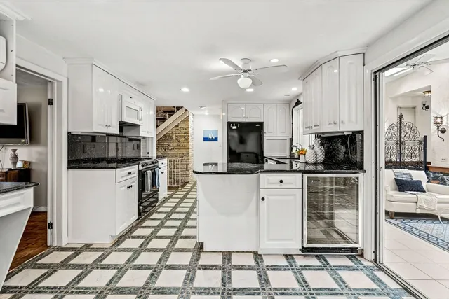 a kitchen with stainless steel appliances and cabinets