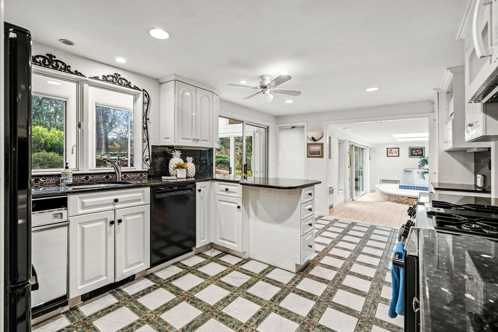 10 Quadrant Road Salem, MA 01970 - Photo 17 of 42 a kitchen with granite countertop a stove sink and refrigerator