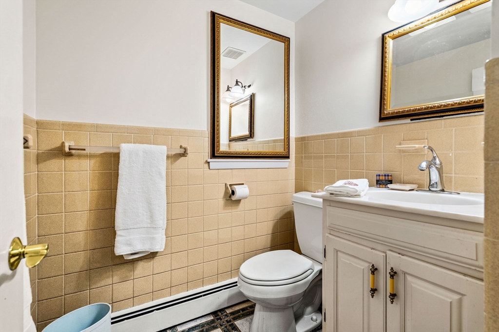10 Quadrant Road Salem, MA 01970 - Photo 21 of 42 a bathroom with a sink toilet and mirror
