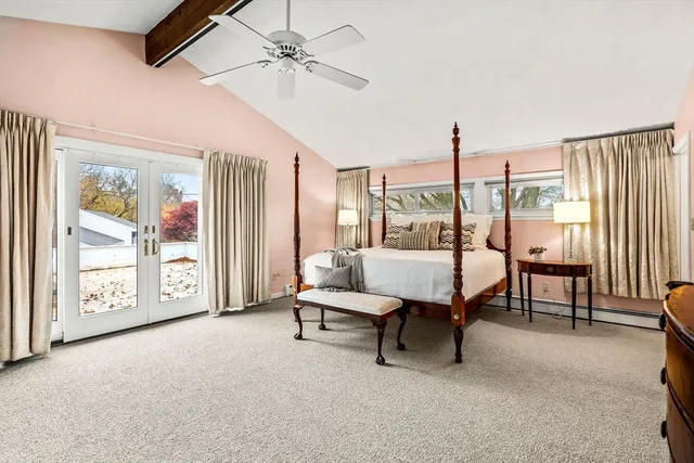a living room with furniture a ceiling fan and a window