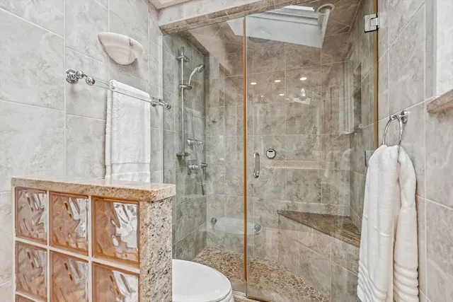 a bathroom with a shower and a sink