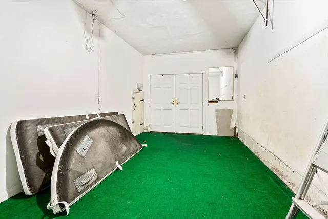 a view of a garage with stairs