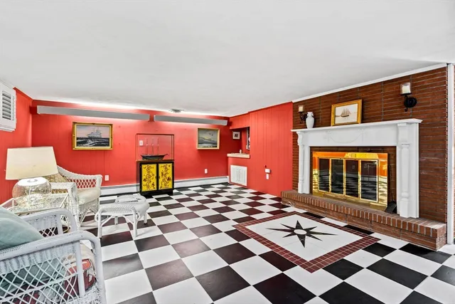 a living room with a couch and a potted plant