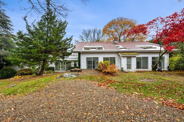 a front view of a house with a garden and porch