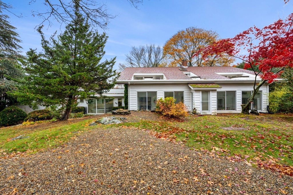 10 Quadrant Road Salem, MA 01970 - Photo 40 of 42 a front view of a house with a garden and porch