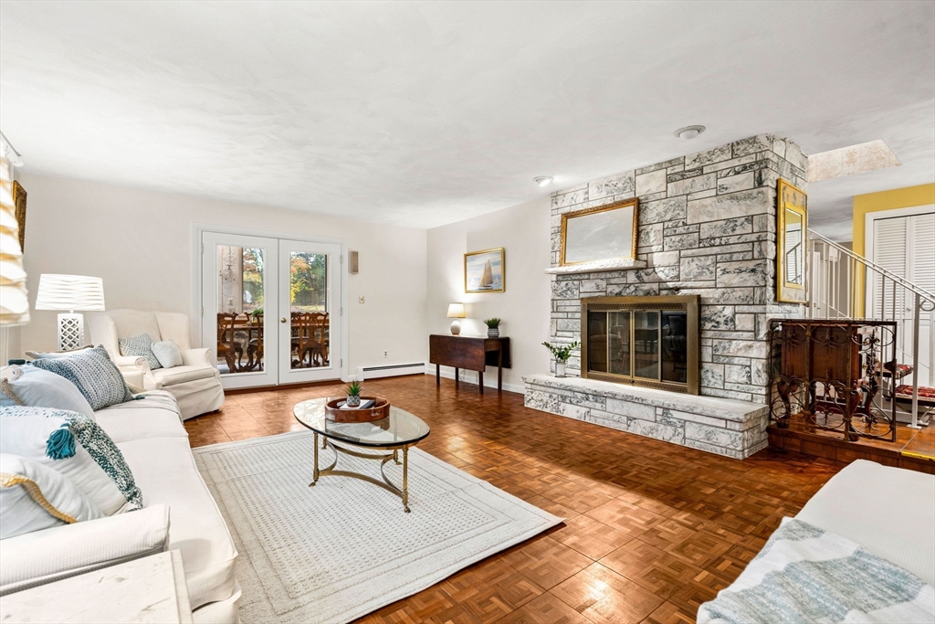 10 Quadrant Road Salem, MA 01970 - Photo 6 of 42 a living room with furniture a fireplace and a table