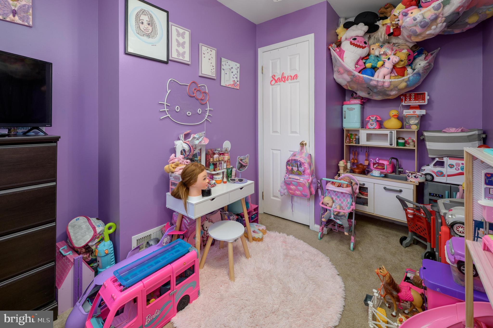 103 Middlesex Street Gloucester City, NJ 08030 - Photo 11 of 31 a living room filled with furniture toys and a flat screen tv
