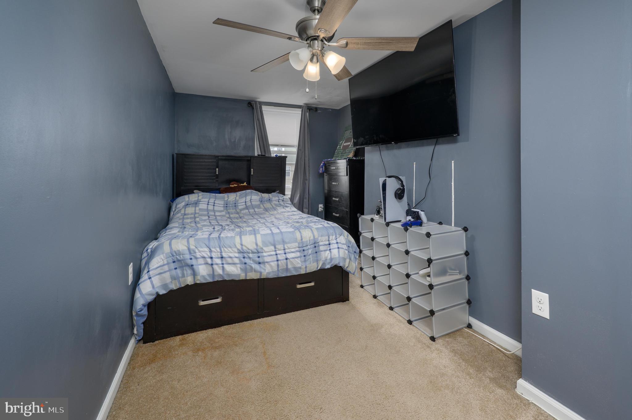 103 Middlesex Street Gloucester City, NJ 08030 - Photo 14 of 31 a bedroom with a bed and a flat screen tv