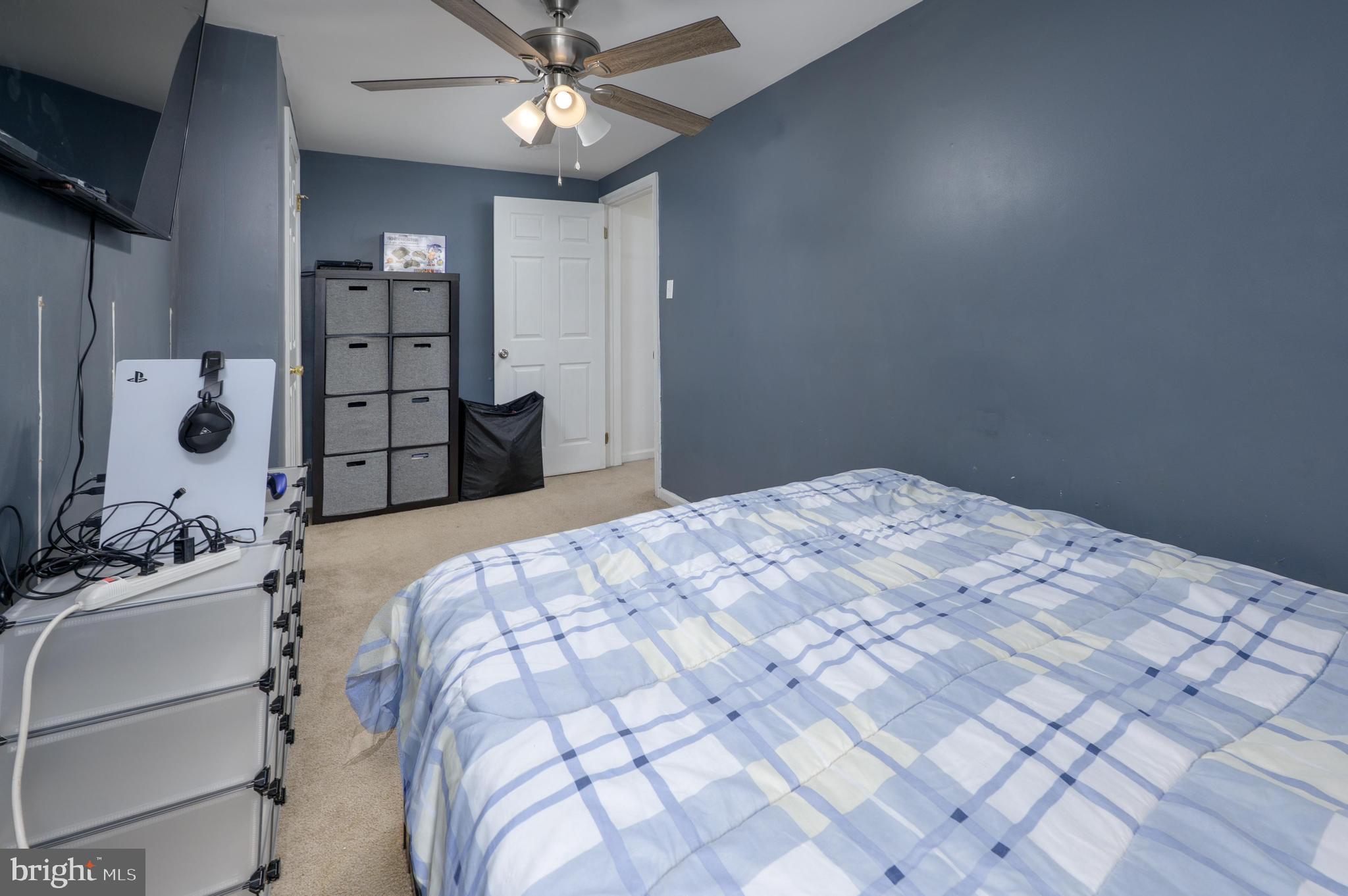 103 Middlesex Street Gloucester City, NJ 08030 - Photo 15 of 31 a bedroom with a bed and a chandelier