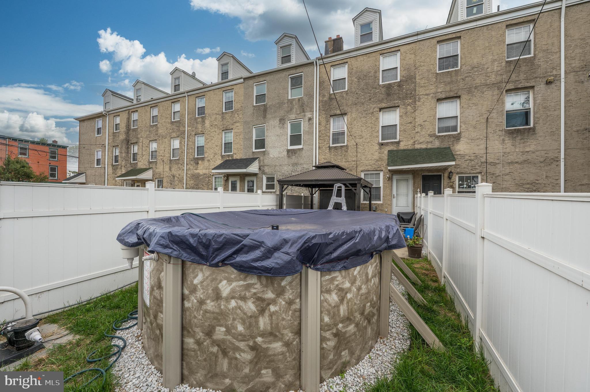 103 Middlesex Street Gloucester City, NJ 08030 - Photo 25 of 31 a view of a house with a tub and a yard