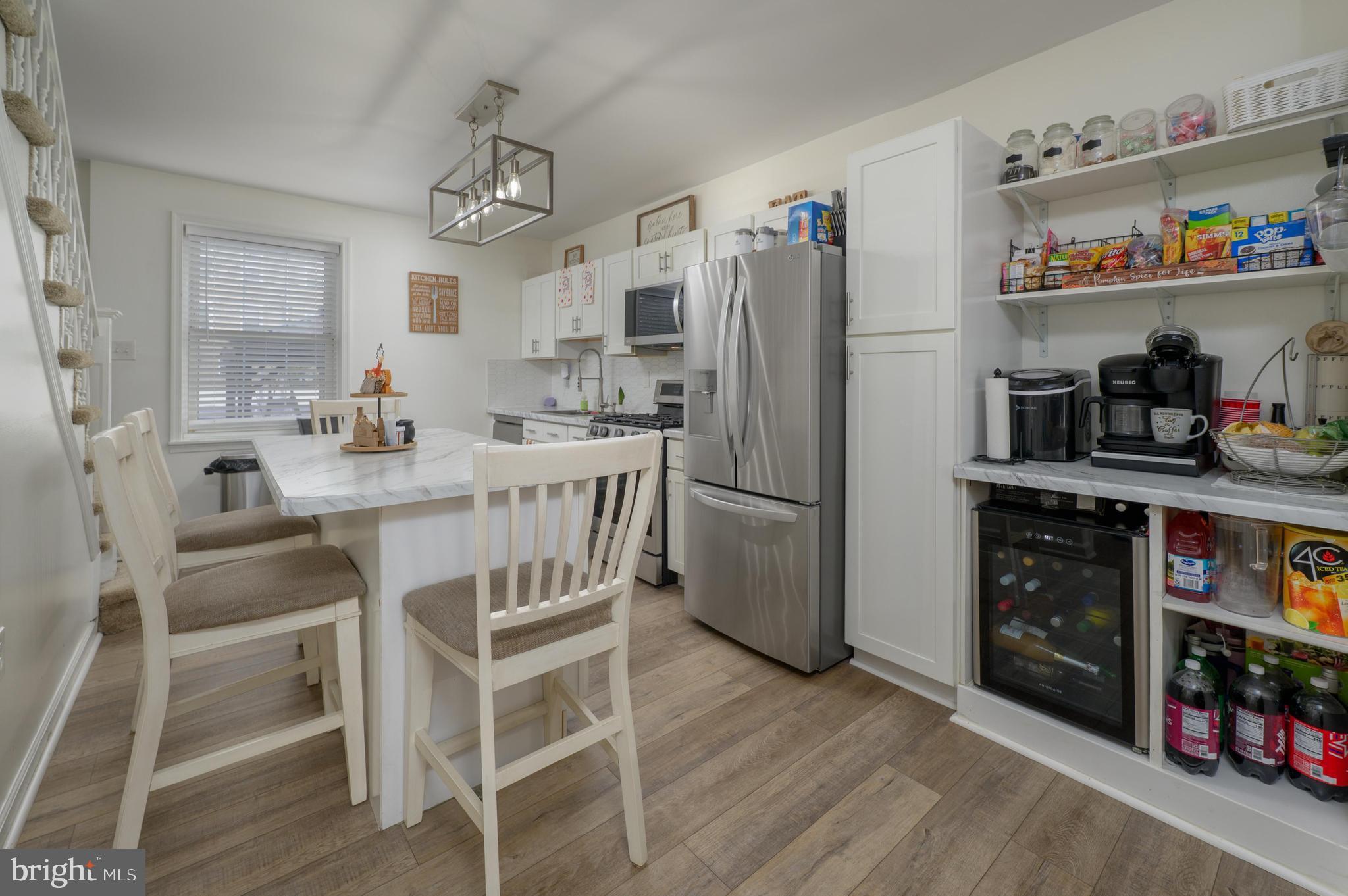 103 Middlesex Street Gloucester City, NJ 08030 - Photo 5 of 31 a kitchen with stainless steel appliances a refrigerator and a wooden cabinets