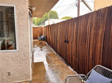 a view of a balcony with wooden fence