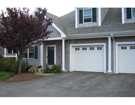 52 County Road, Unit 9 Mattapoisett, MA 02739 - Photo 1 of 1 a front view of a house with garden