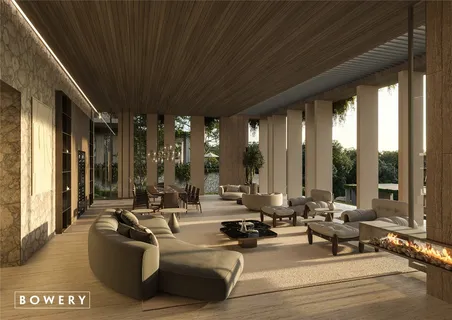 a living room with furniture and large windows