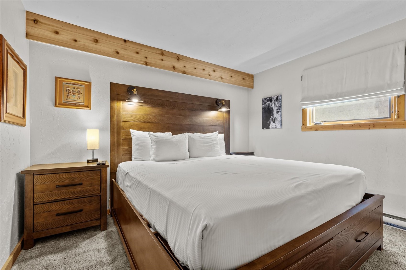2602 Longthong Road, Unit 107 Steamboat Springs, CO 80487 - Photo 13 of 32 a bedroom with a bed and a dresser