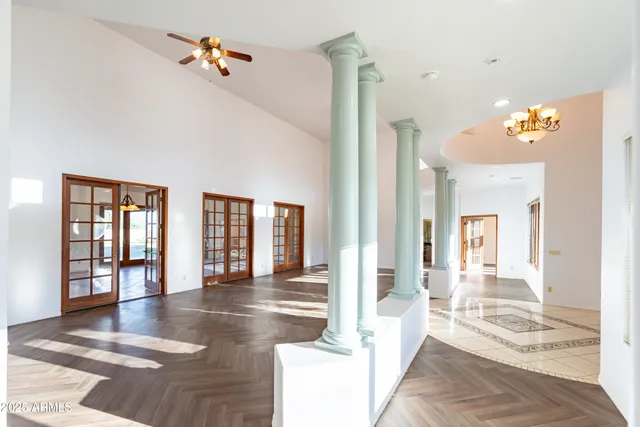 a view of a kitchen with a sink and cabinets