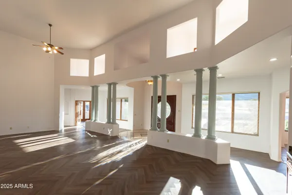 a view of a livingroom with a furniture and chandelier