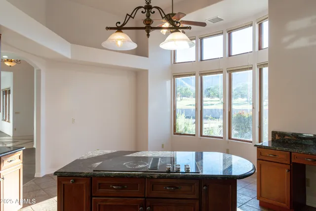 a view of a livingroom with wooden floor and windows