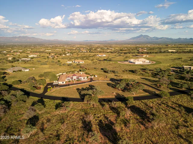 a view of a room with wooden floor and staircase