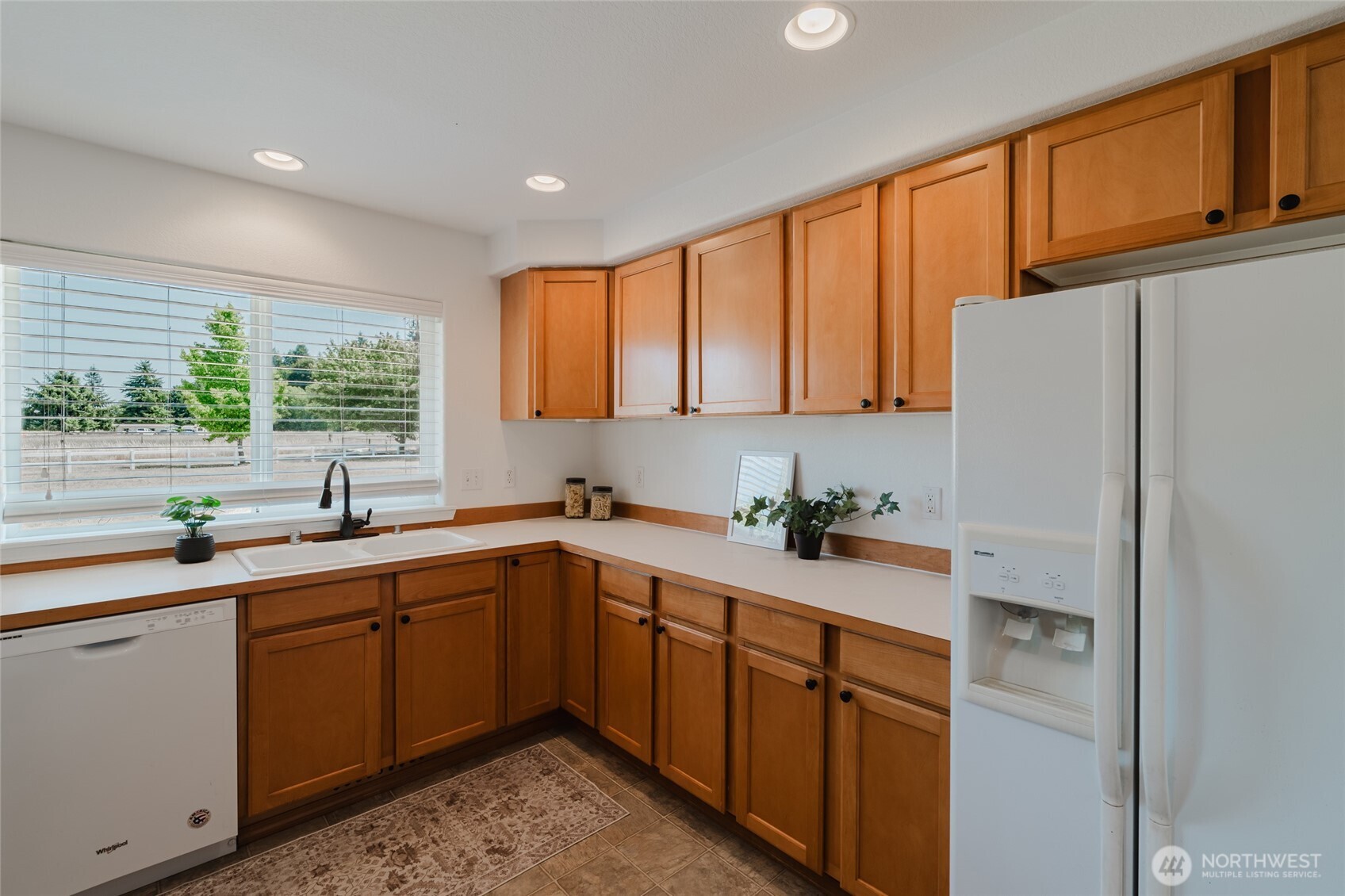 9519 184th Avenue Southwest Rochester, WA 98579 - Photo 11 of 38 a kitchen with a sink refrigerator and window
