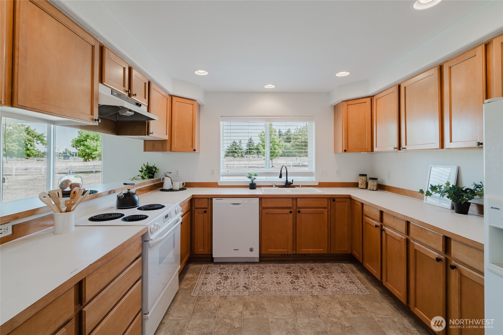 9519 184th Avenue Southwest Rochester, WA 98579 - Photo 12 of 38 a kitchen with a sink stove and cabinets
