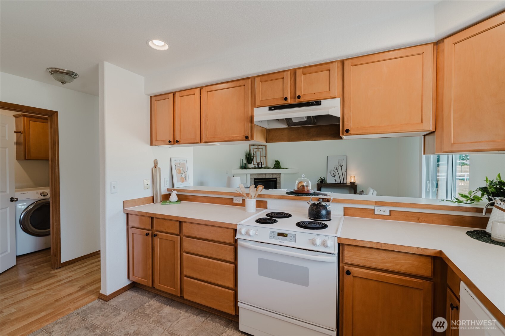 9519 184th Avenue Southwest Rochester, WA 98579 - Photo 13 of 38 a kitchen with a sink a stove and cabinets