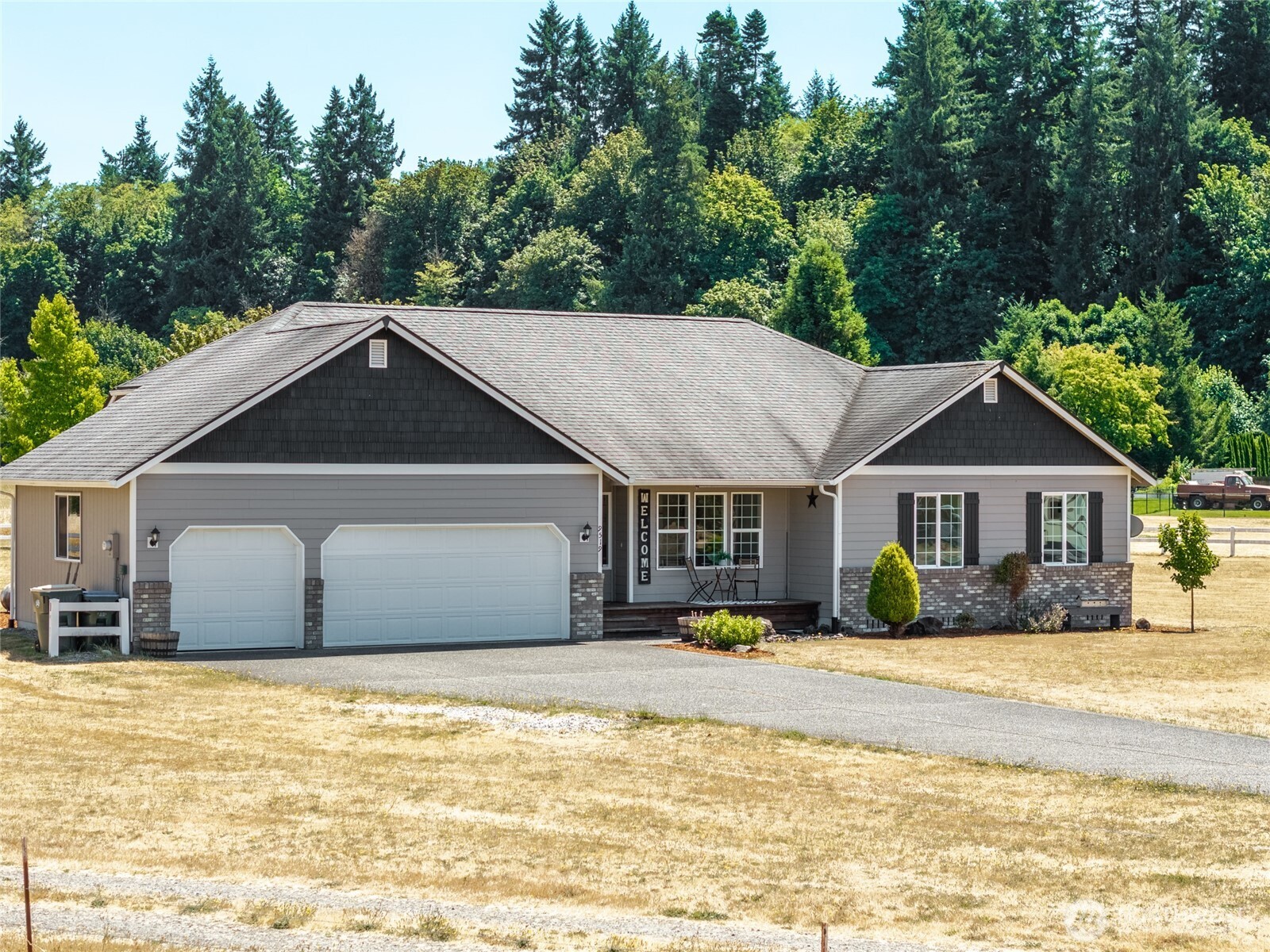 9519 184th Avenue Southwest Rochester, WA 98579 - Photo 2 of 38 a front view of a house with a yard
