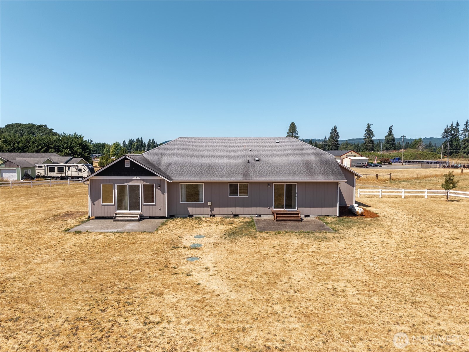 9519 184th Avenue Southwest Rochester, WA 98579 - Photo 27 of 38 a house with trees in the background