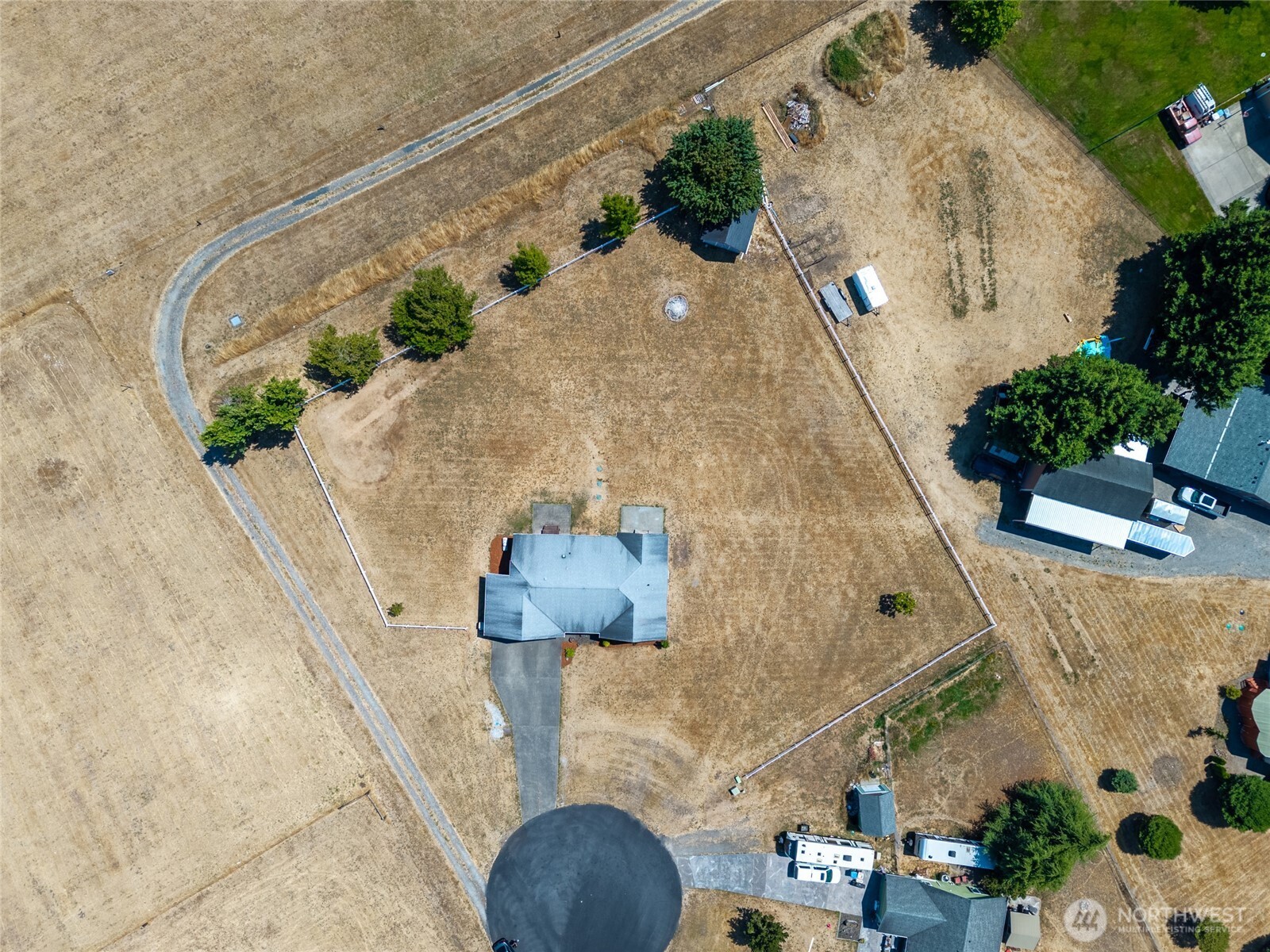 9519 184th Avenue Southwest Rochester, WA 98579 - Photo 34 of 38 an aerial view of a house with a yard and potted plants
