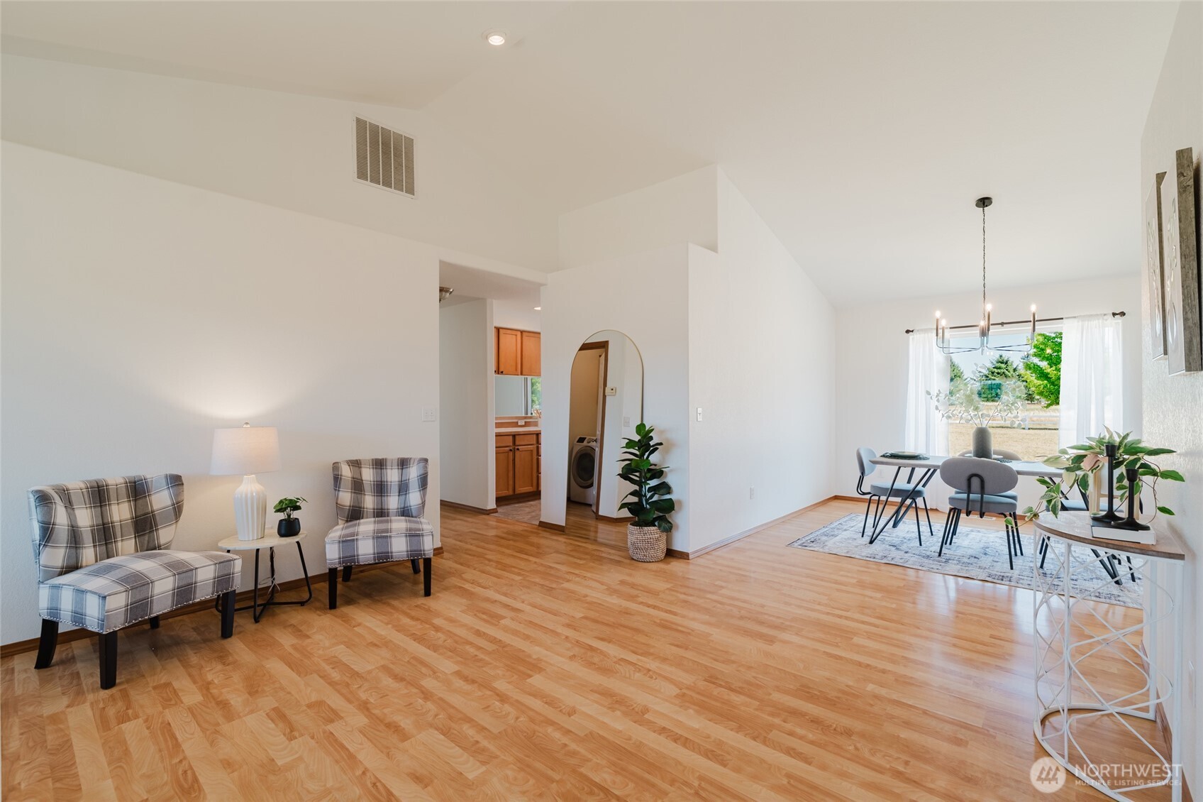 9519 184th Avenue Southwest Rochester, WA 98579 - Photo 7 of 38 a living room with furniture and a wooden floor