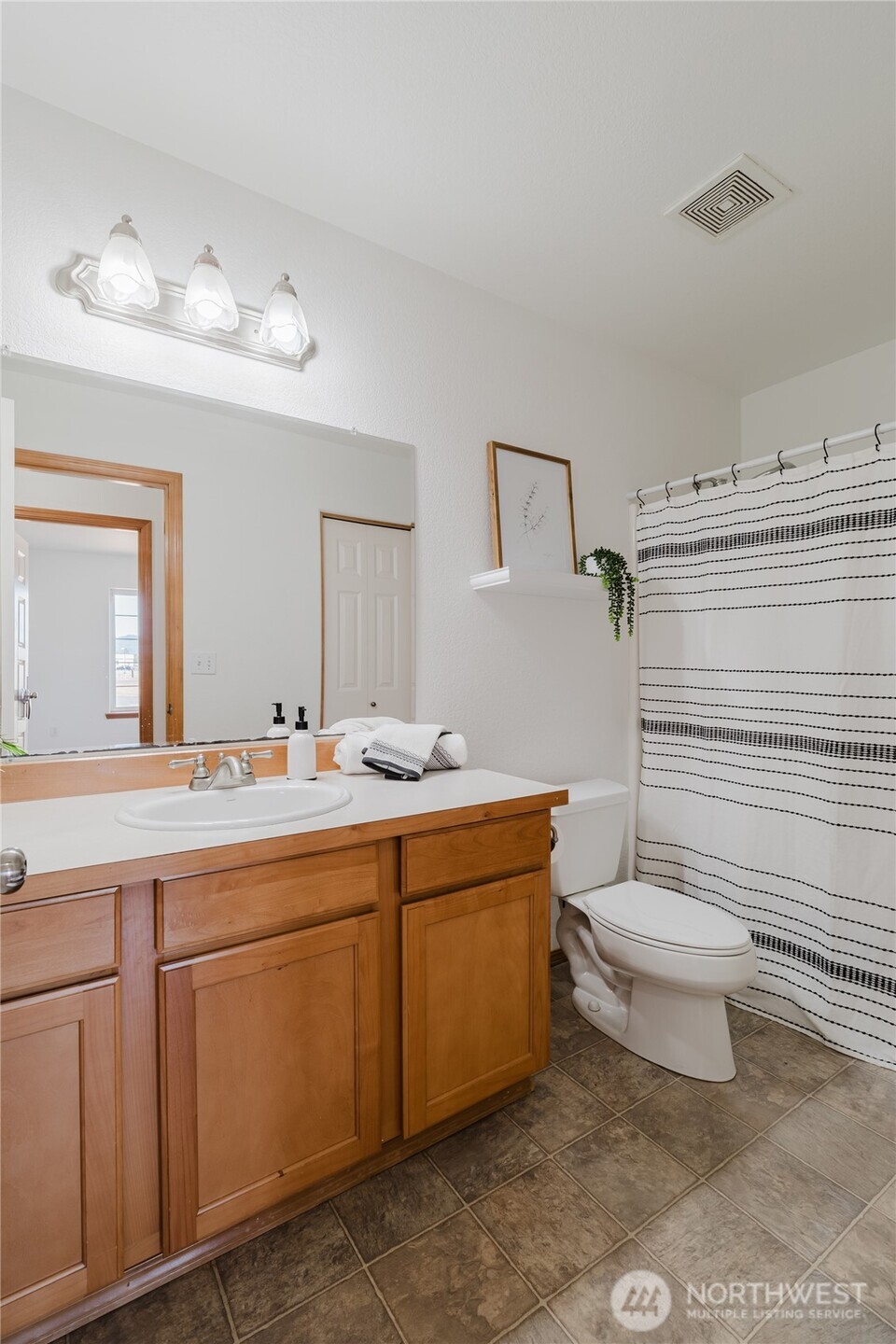 9519 184th Avenue Southwest Rochester, WA 98579 - Photo 10 of 38 a bathroom with a toilet sink and mirror