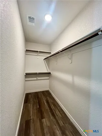 a view of a room with racks on the wall