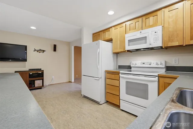 a spacious bathroom with a double vanity sink and a large mirror