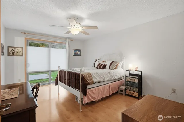 a bedroom with a bed and a chandelier