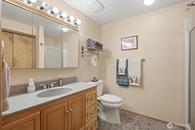 a view of a room that has a bed in it