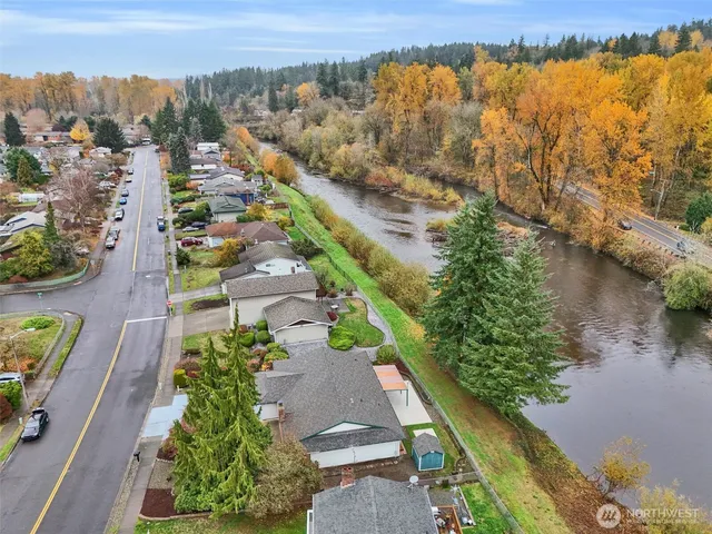 an aerial view of residential houses with outdoor space