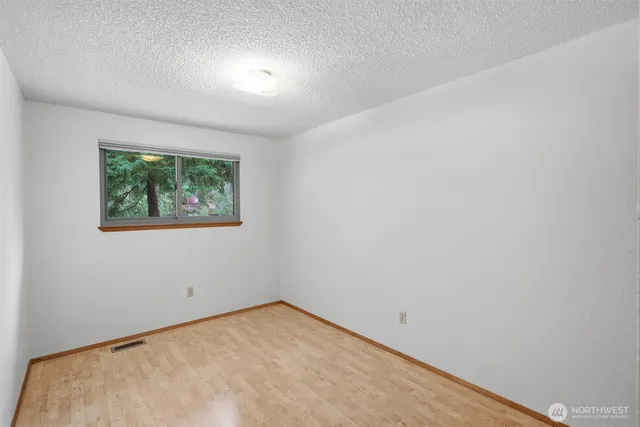 a bathroom with a toilet a sink and shower