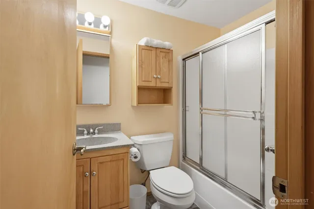 a view of a storage & utility room with dryer and washer