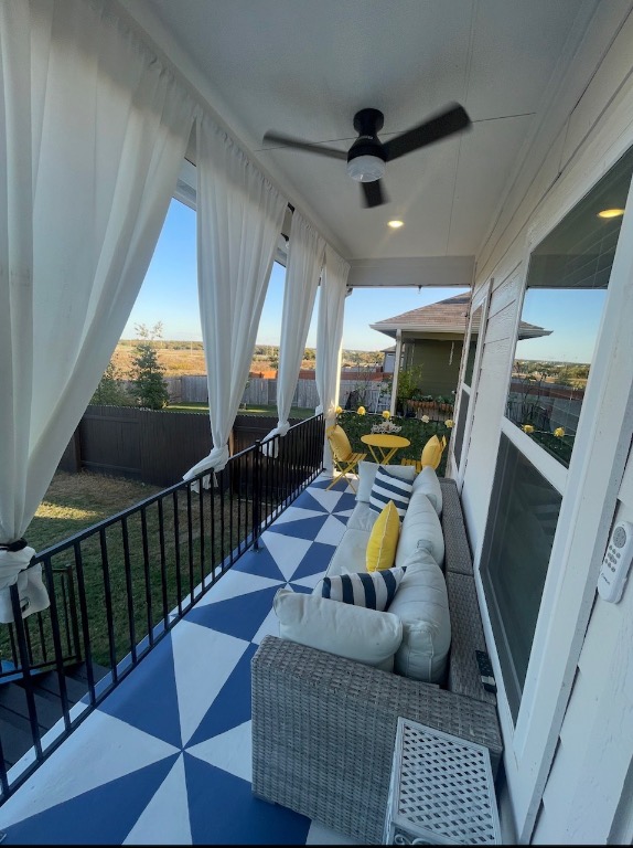 2917 Mill Run Bend Round Rock, TX 78665 - Photo 7 of 8 Balcony with a ceiling fan and outdoor lounge area, custom decorative floor design